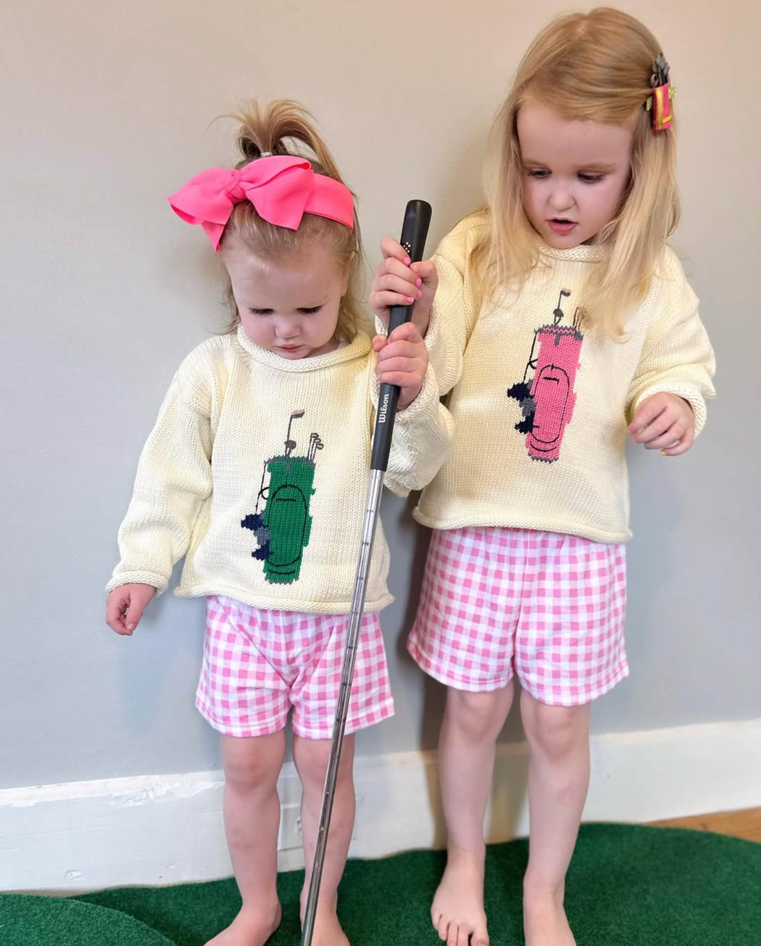 girls wearing golf sweaters