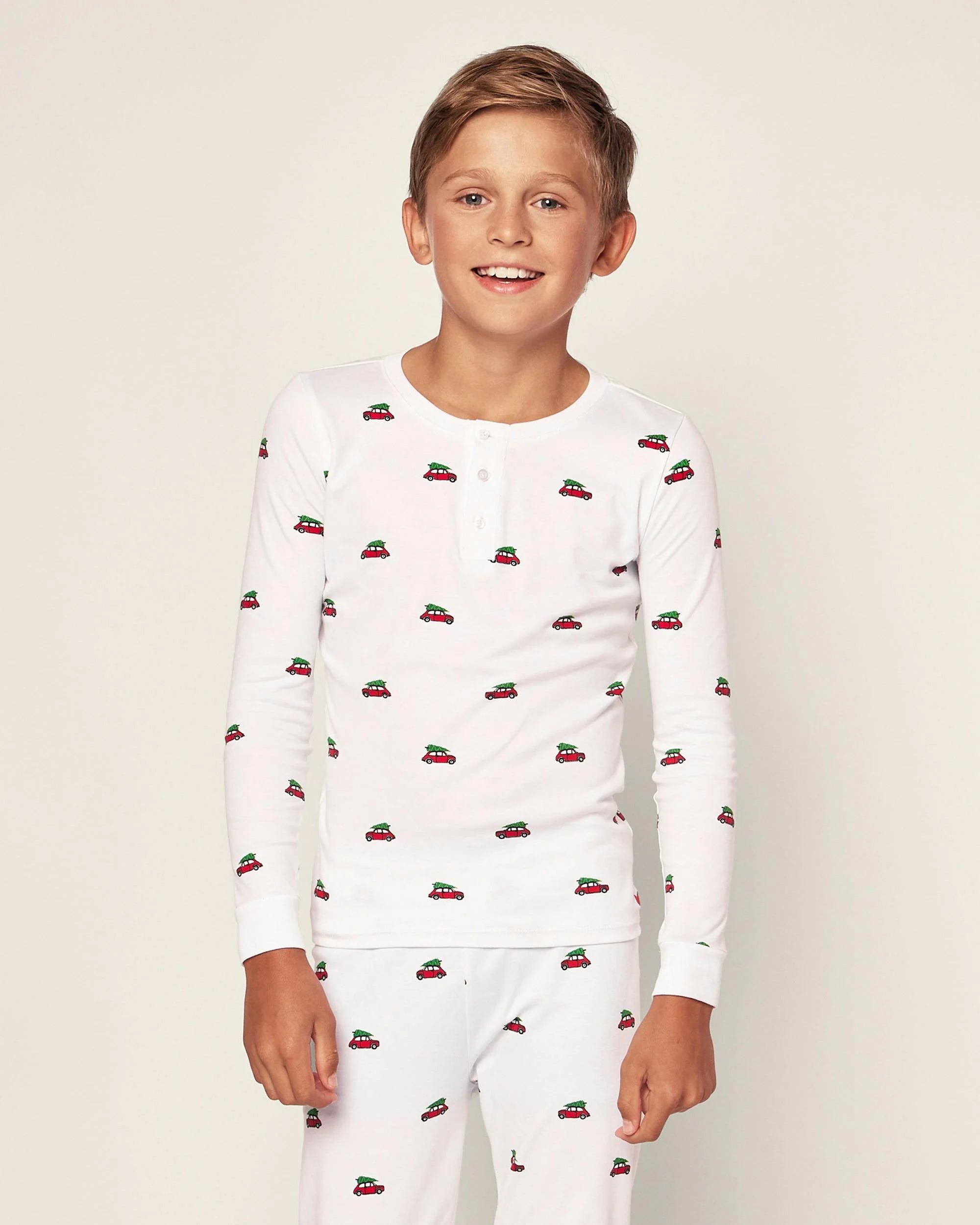 white pajamas with red cars with trees on top