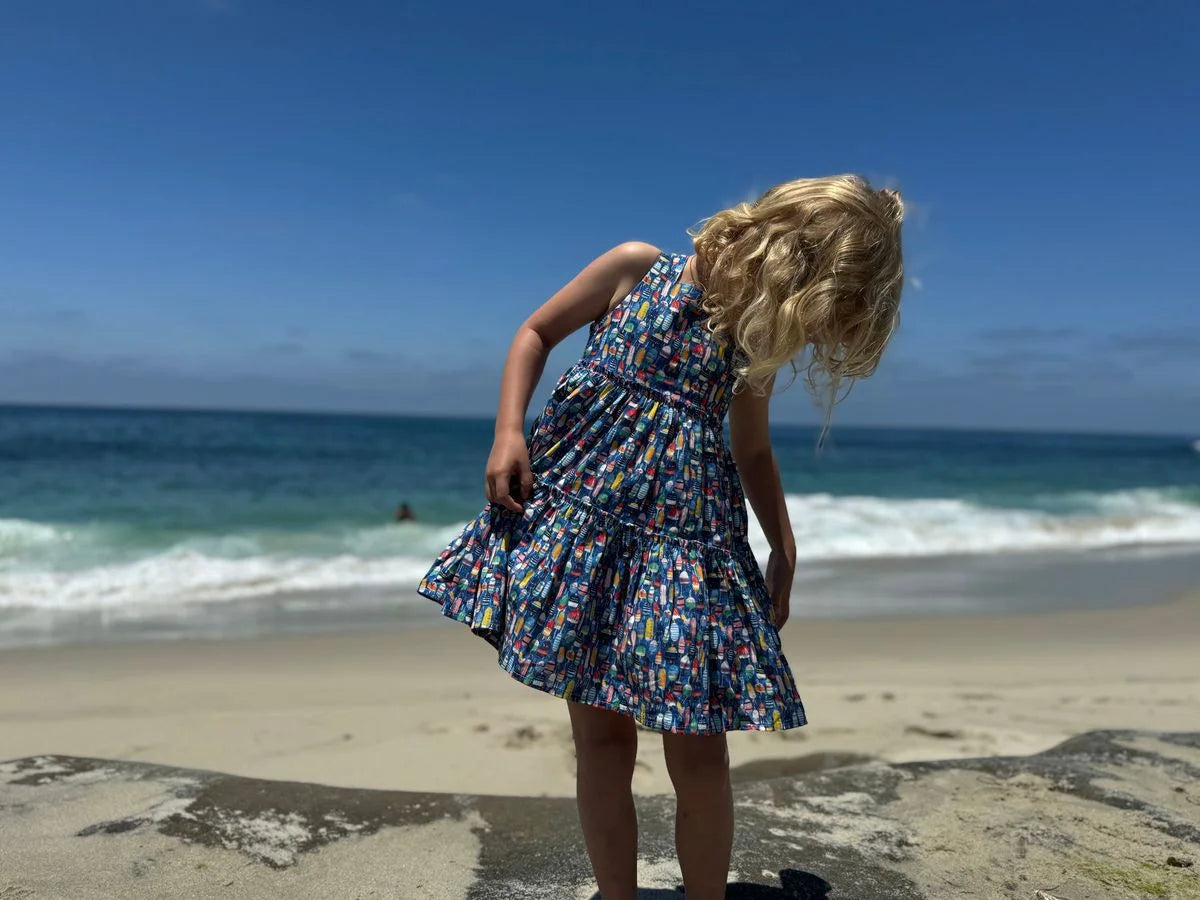 girl wearing buoy dress on beach