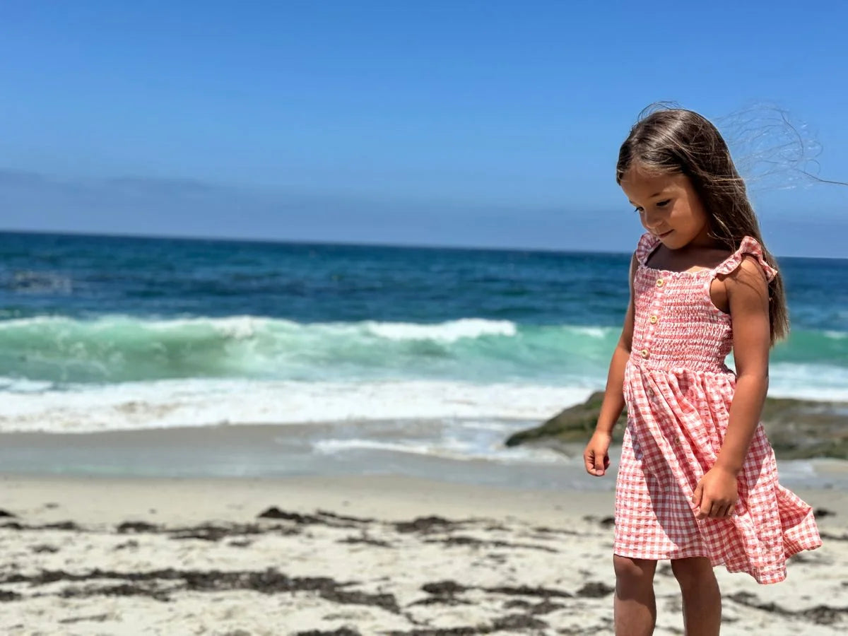 girl wearing dress on beach