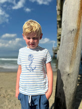 boy wearing the shirt on the beach