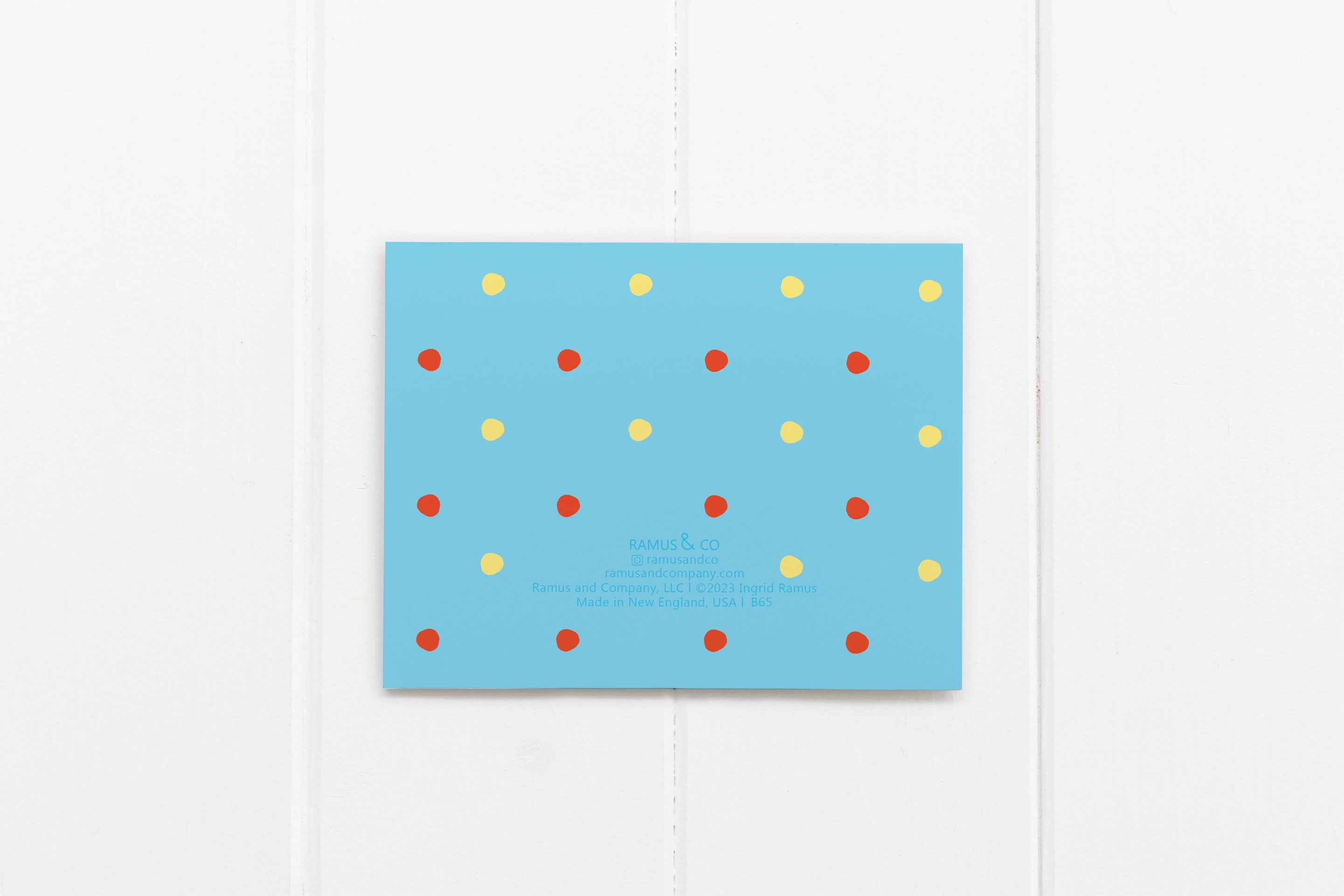 back of card has red and yellow polka dots