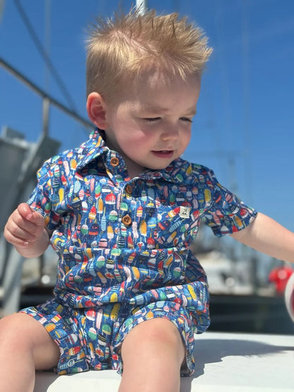 little boy on a dock wearing the buoy romper