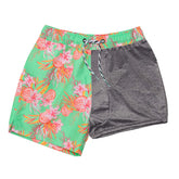 green swim shorts with coastal shells design