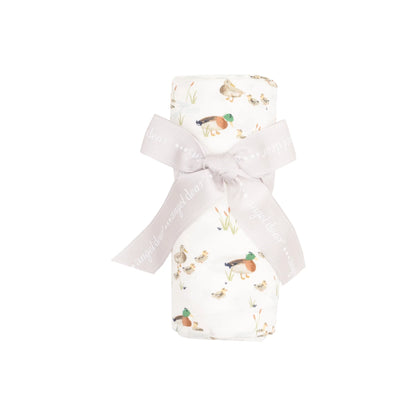 white swaddle with ducks and ducklings all over
