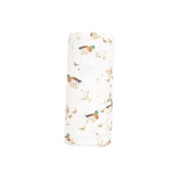 white swaddle with ducks and ducklings all over