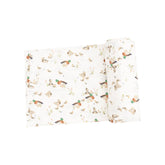 white swaddle with ducks and ducklings all over