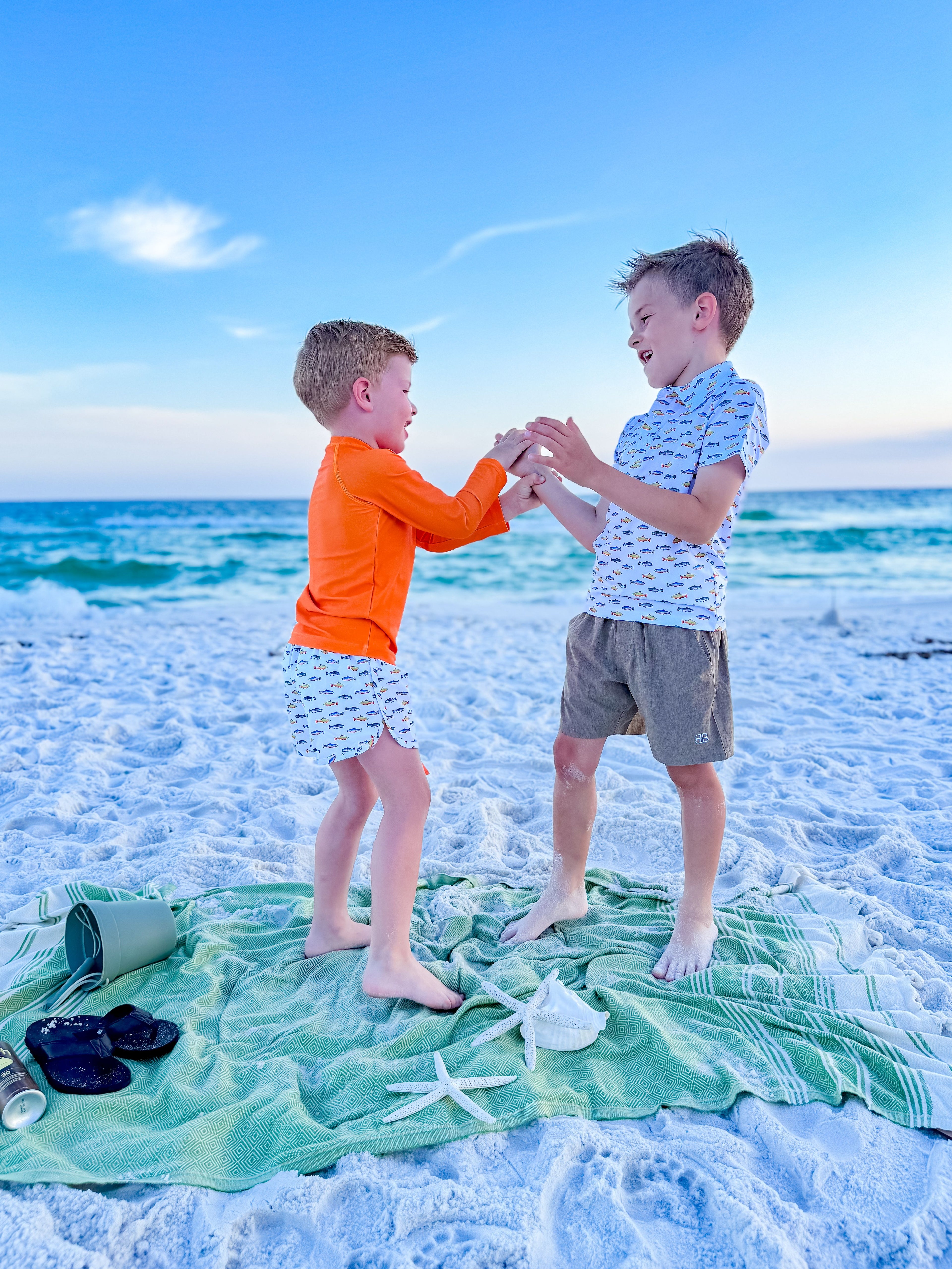 boys playing on the beach