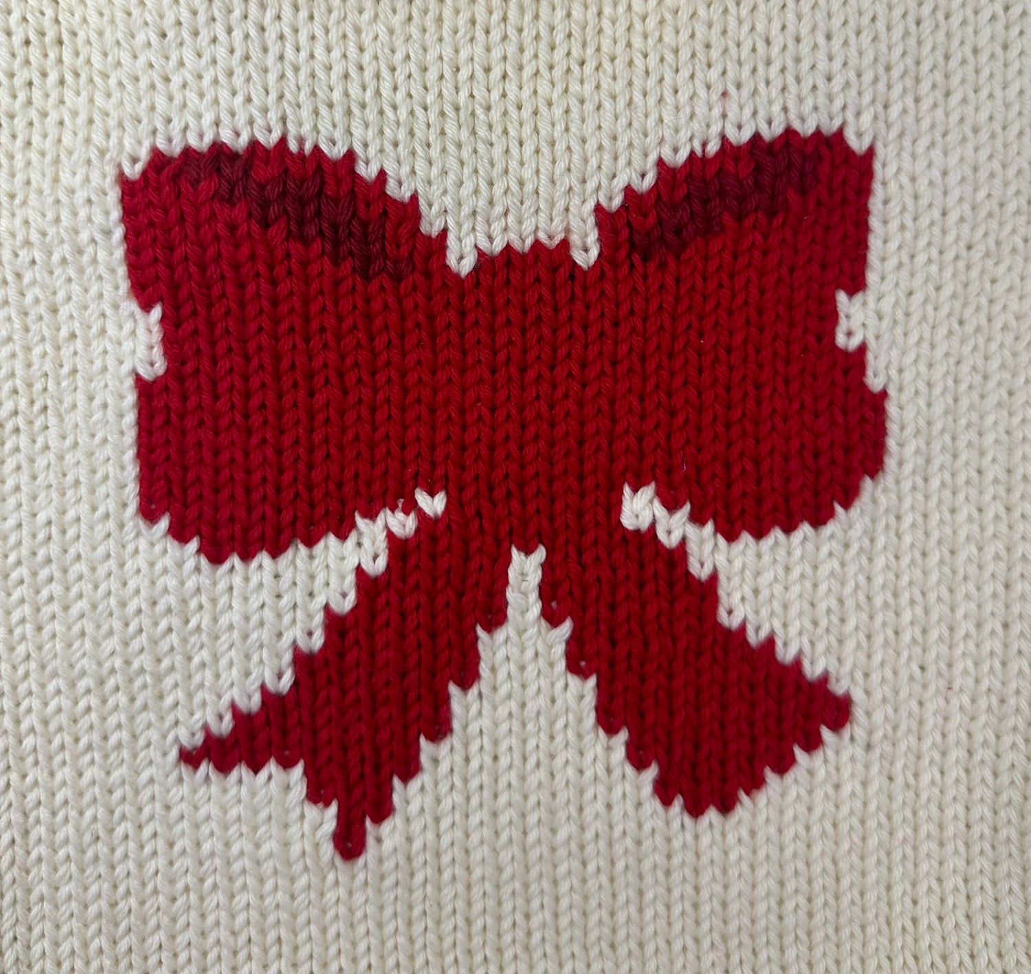 red bow on ivory background