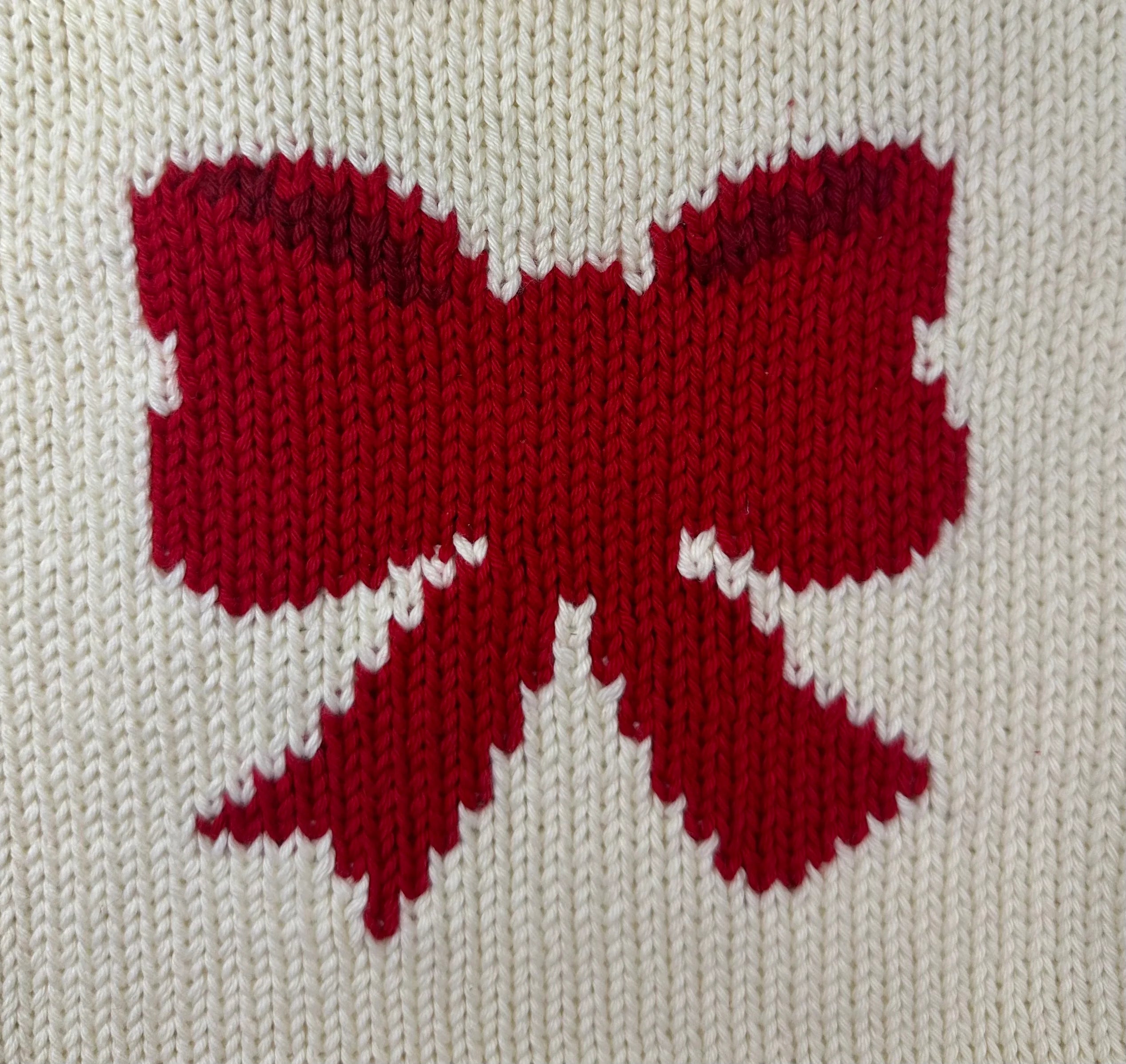 red bow on ivory background