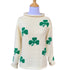 ivory roll neck sweater with green shamrocks knitted all over