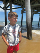 boy wearing the shirt on beach