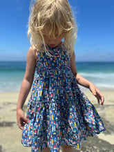 girl wearing buoy dress on the beach