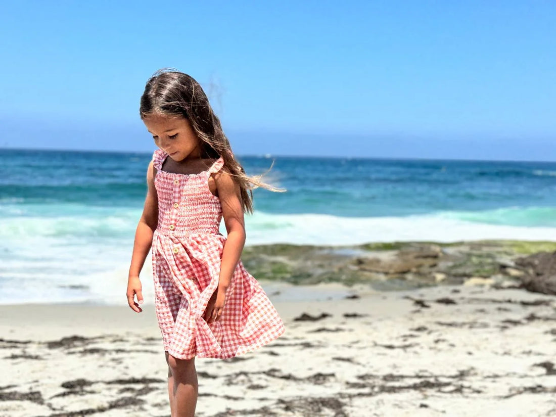 girl wearing dress on beach