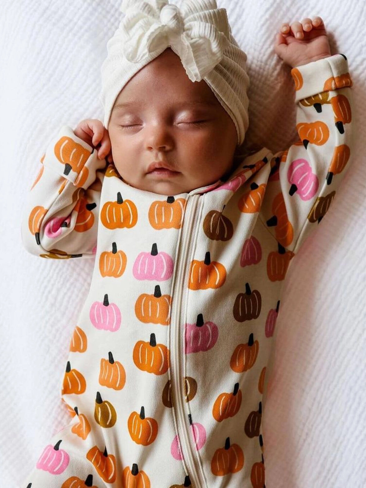 romper with orange, tan and pink pumpkins all over