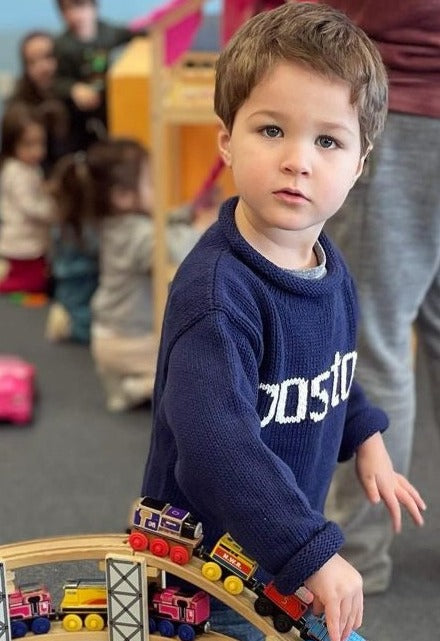 boy wearing boston sweater