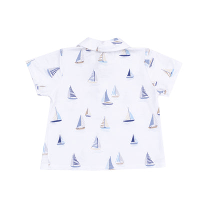 white shirt with sailboats on it