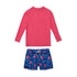 red top with navy swim shorts with sailboats all over