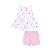 top is white with pink sailboats and solid pink shorts