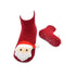 red socks with stuffed Santa heads on toes