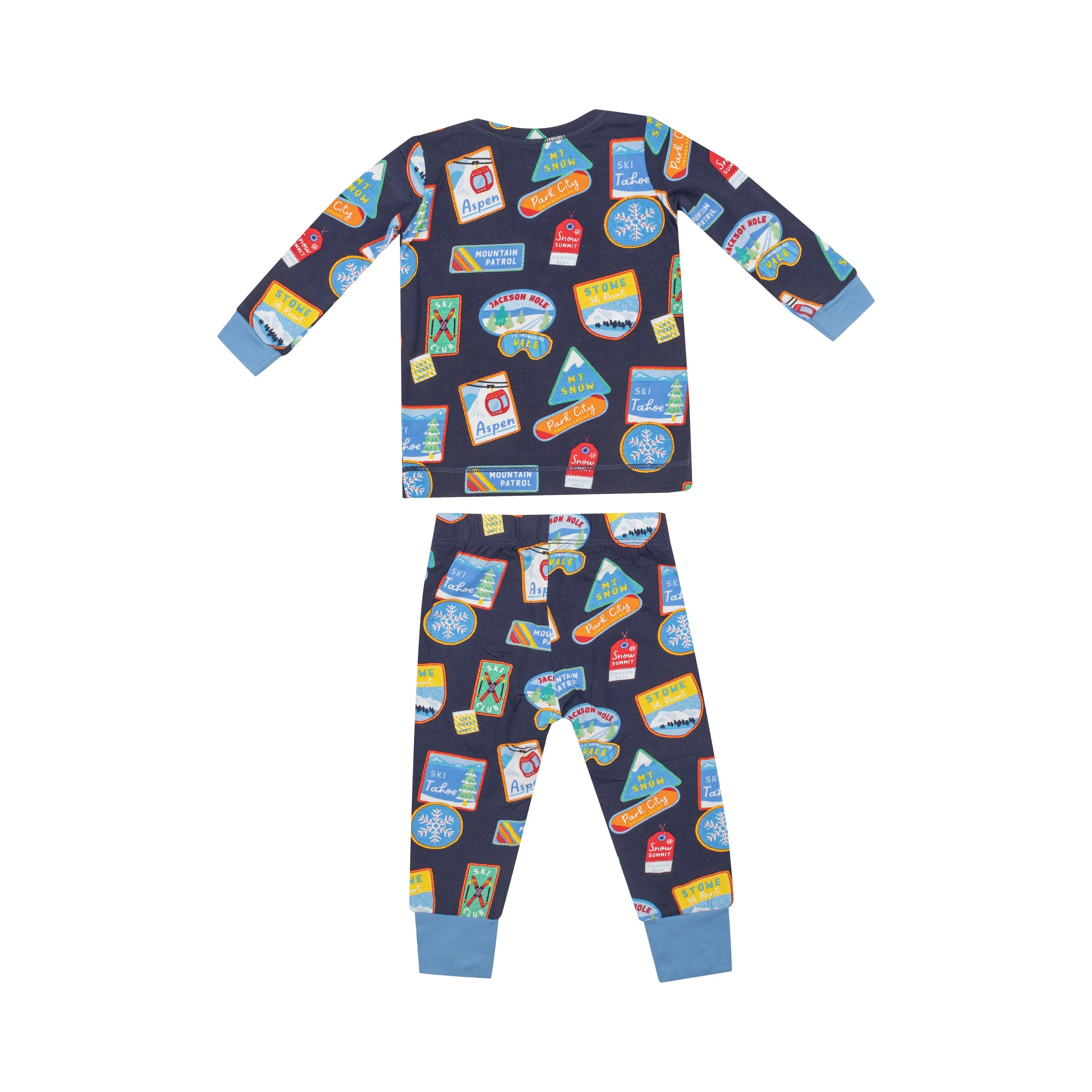 black pajamas with blue trim and colorful vintage ski patches all over