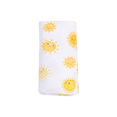 white swaddle blanket with yellow suns all over