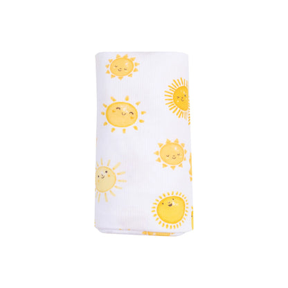 white swaddle blanket with yellow suns all over