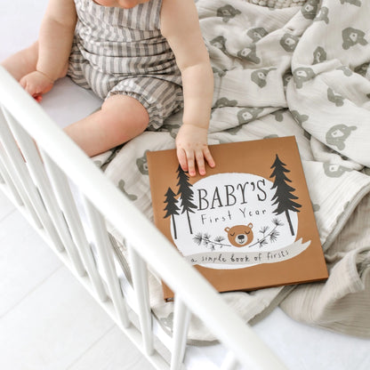 showing baby in crib with the book