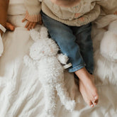 baby with bunny plush