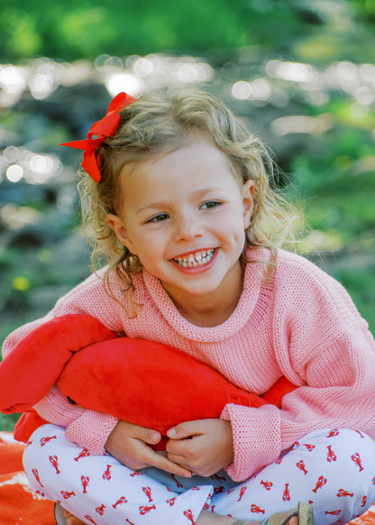 girl wearing pink lobster sweater and lobster leggings