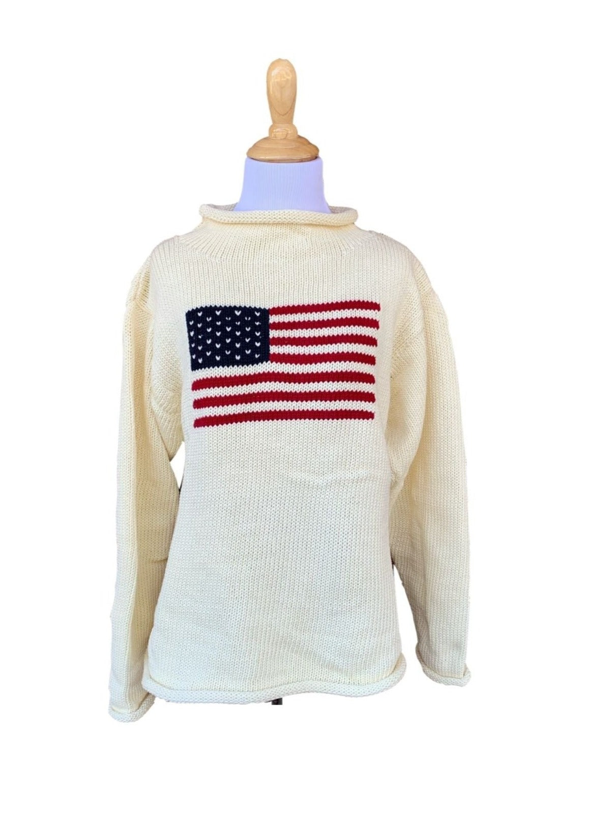 long sleeve ivory roll neck sweater with flag with red stripes and blue square with white stars in center of sweater