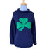 navy long sleeve sweater with green shamrock in center