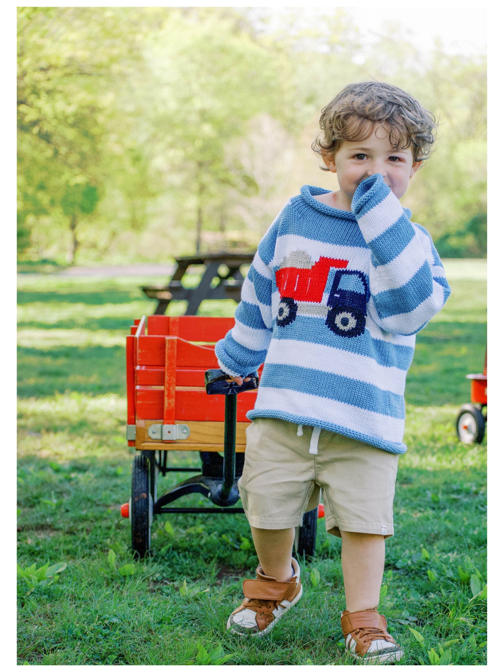 boy wearing striped sweater