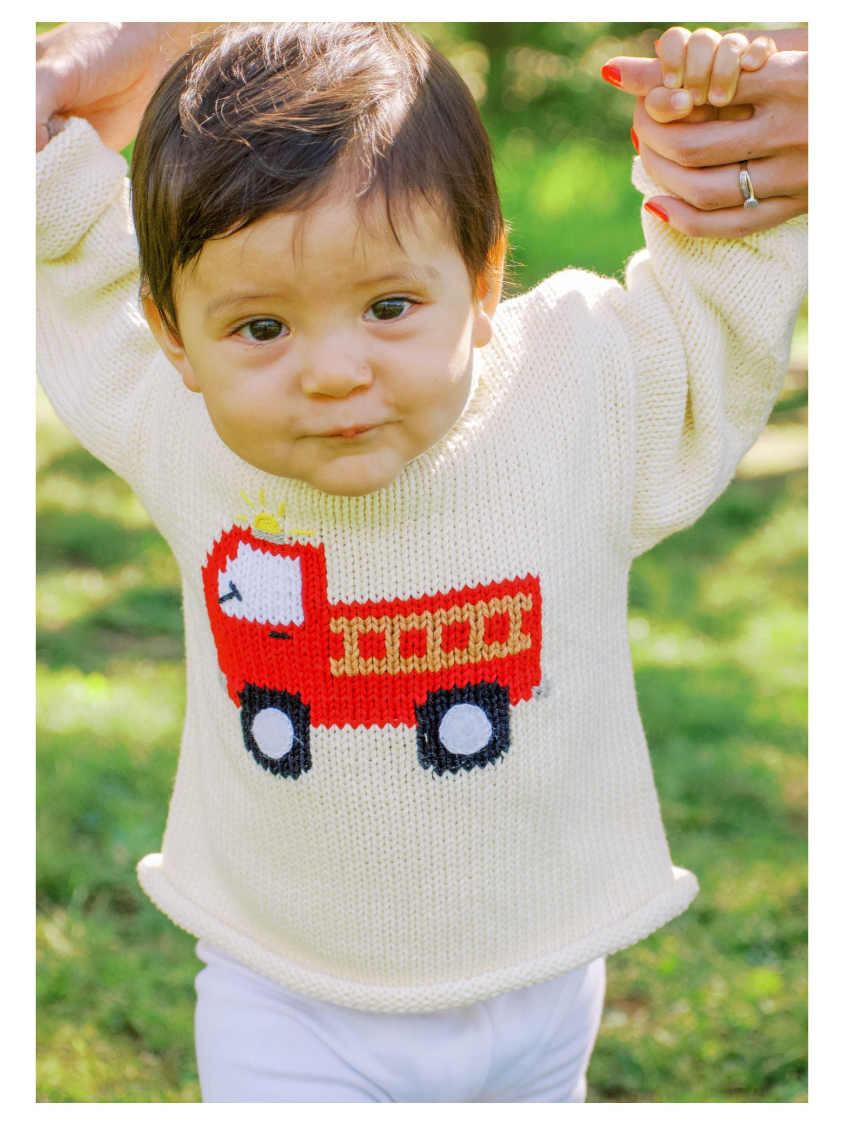 baby wearing Ivory Firetruck sweater