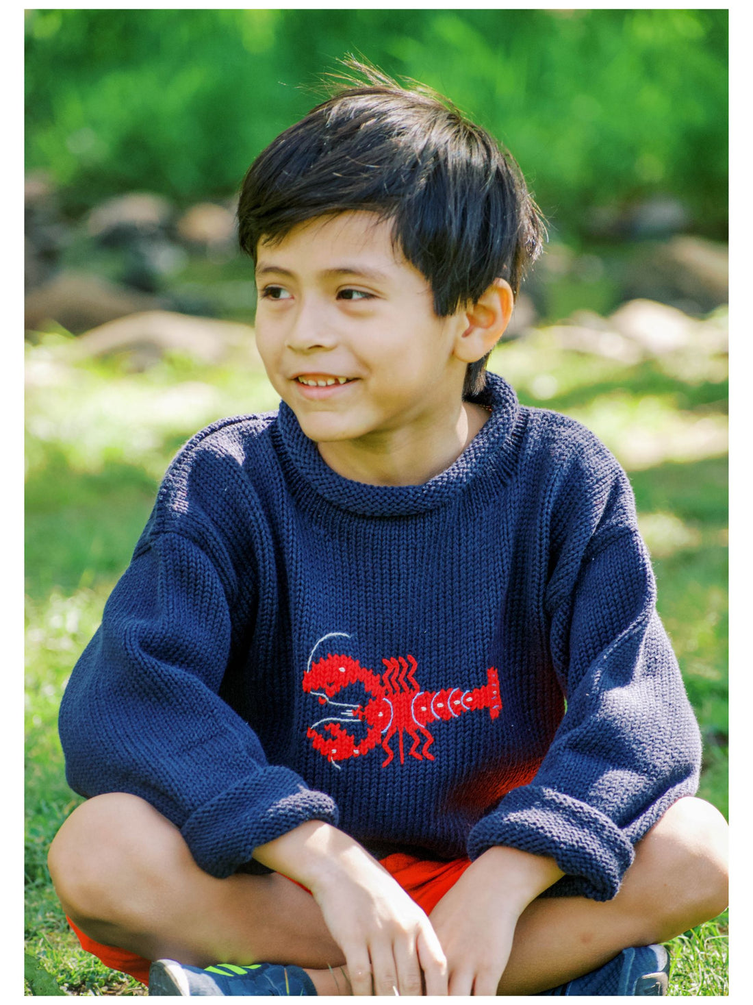 boy wearing navy lobster sweater