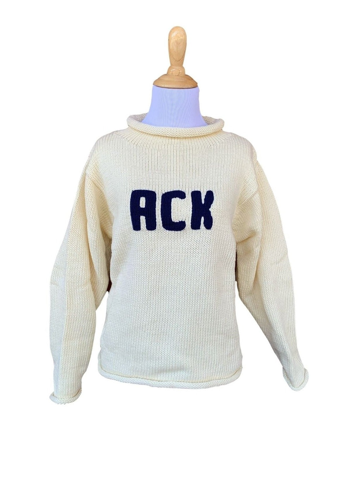 long sleeve ivory sweater with ACK written in navy 