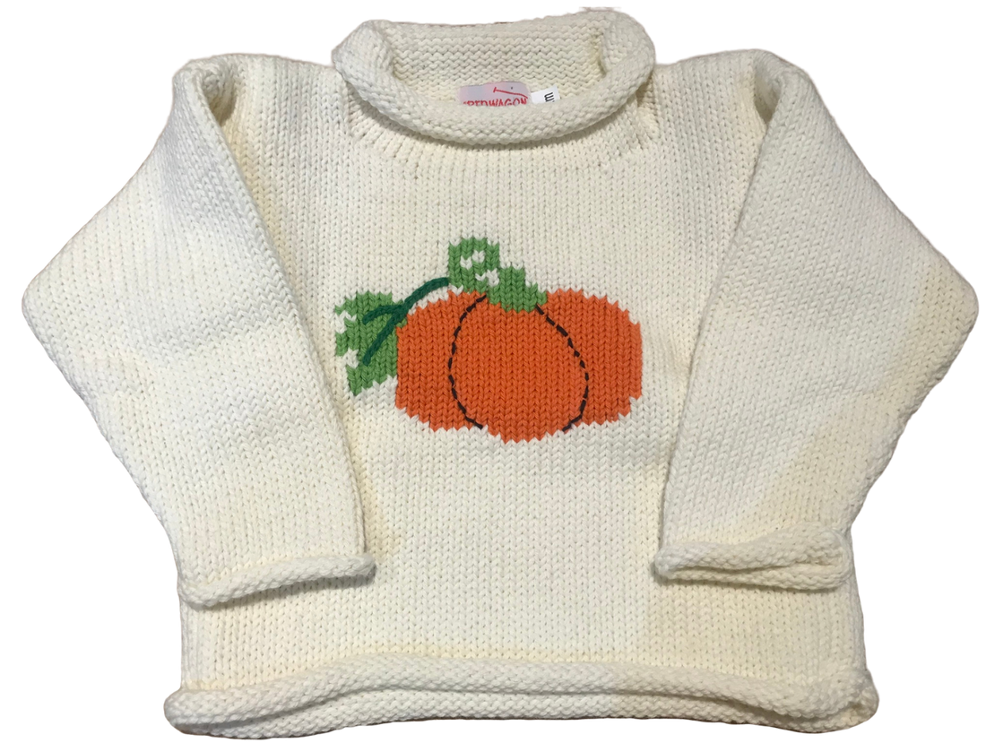 long sleeve ivory sweater with orange pumpkin in center