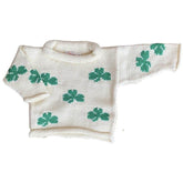 ivory roll neck sweater with green shamrocks knitted all over