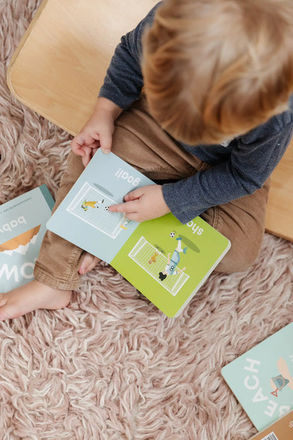 kid reading soccer book