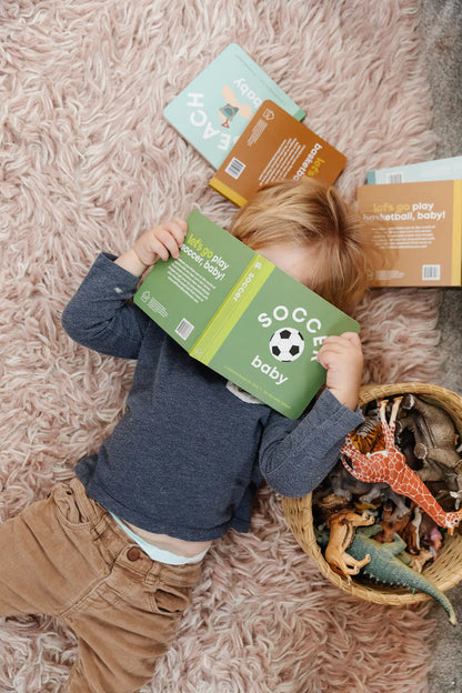 kid reading soccer book